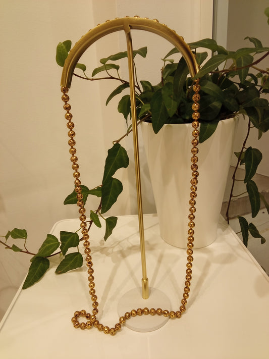 Long gold tone beaded necklace
