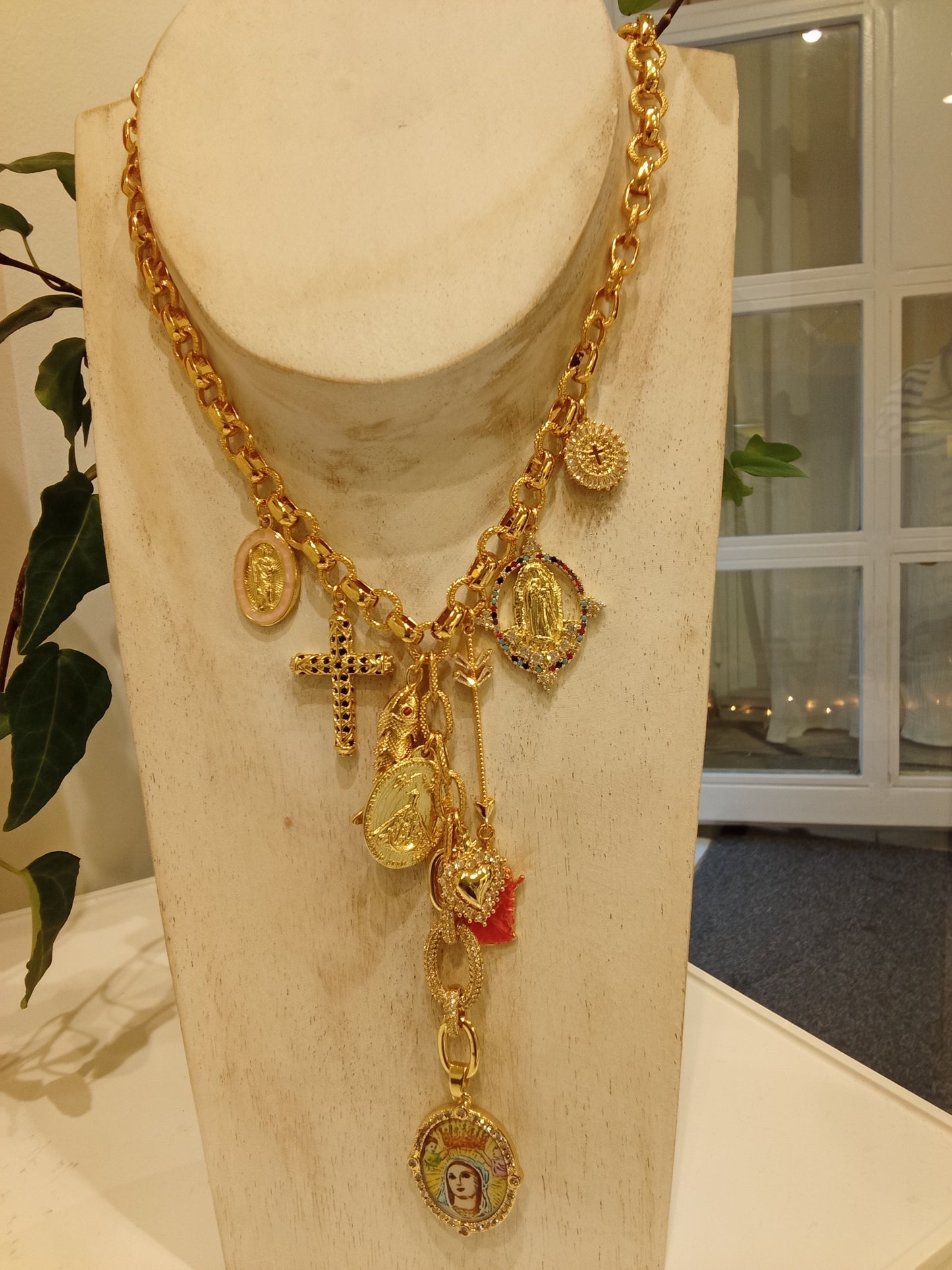 Necklace with cross and several medallions