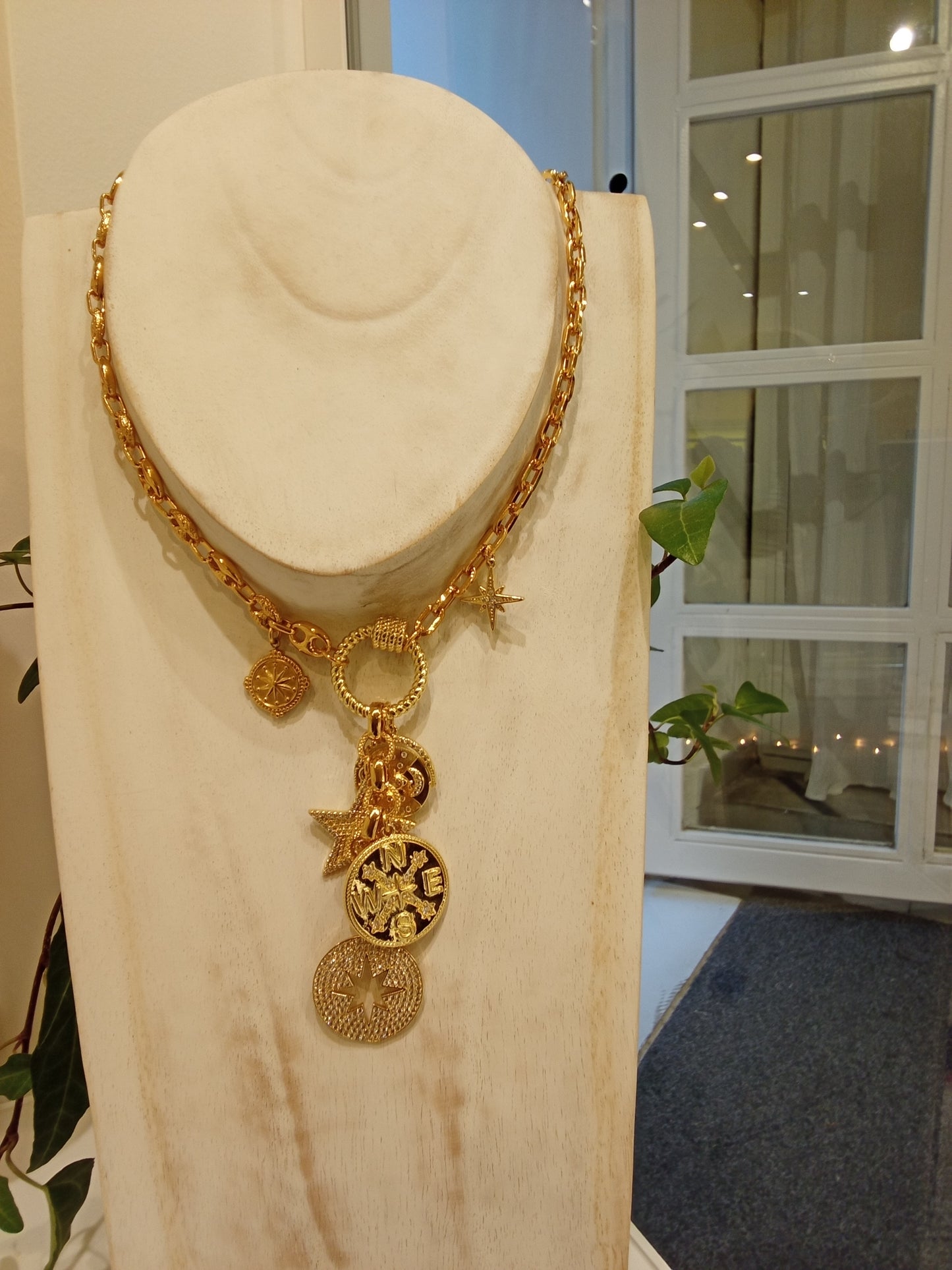 Necklace with multi charms of sun,moon & stars