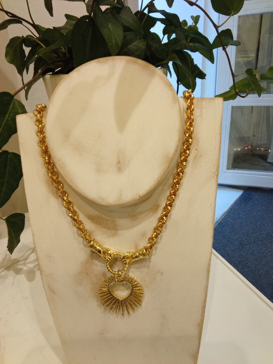 Necklace with heart and two hands attached