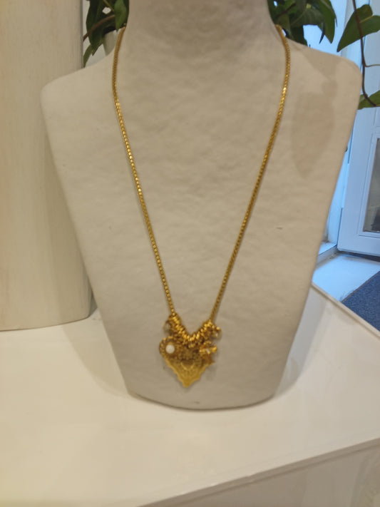 Necklace with a heart cross charm