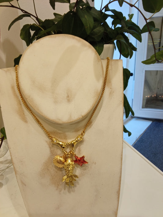 Necklace with fish, shell & star fish charm